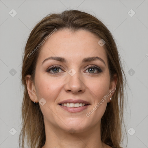 Joyful white young-adult female with medium  brown hair and grey eyes