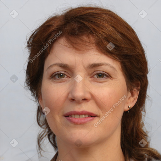 Joyful white young-adult female with medium  brown hair and blue eyes