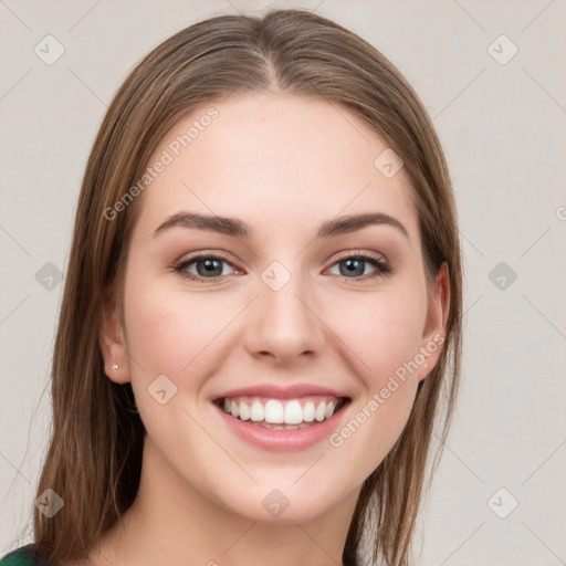 Joyful white young-adult female with long  brown hair and green eyes