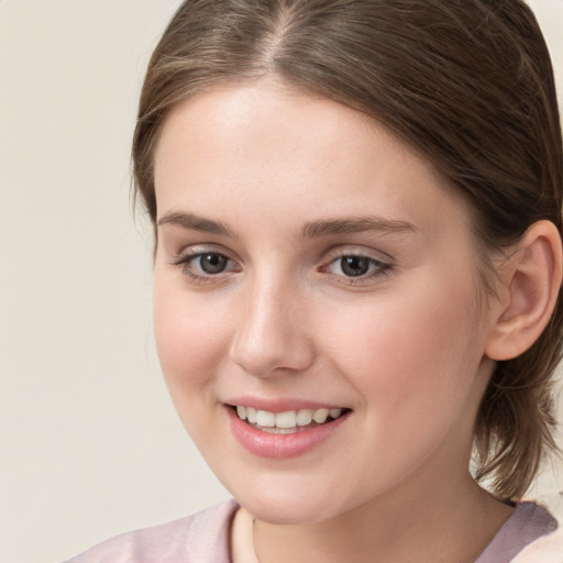 Joyful white young-adult female with medium  brown hair and blue eyes