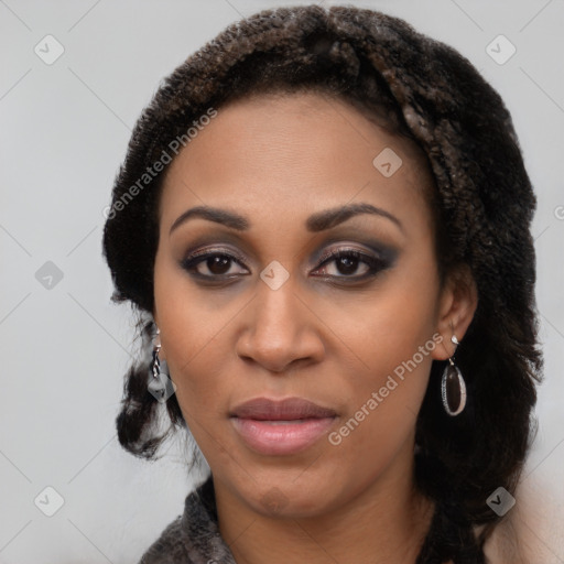 Joyful black young-adult female with long  black hair and brown eyes