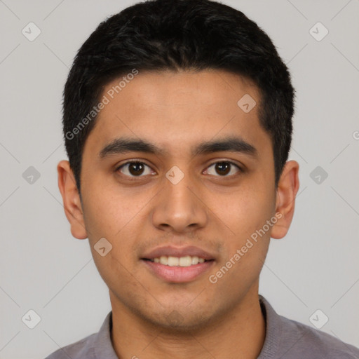 Joyful latino young-adult male with short  black hair and brown eyes