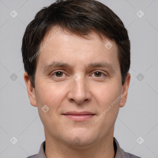 Joyful white adult male with short  brown hair and brown eyes