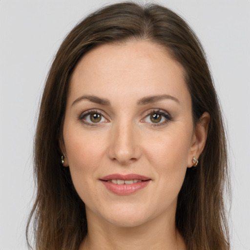 Joyful white young-adult female with long  brown hair and grey eyes