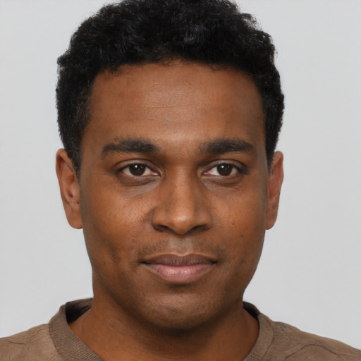 Neutral black young-adult male with short  black hair and brown eyes