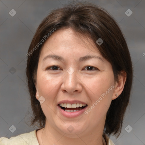 Joyful white adult female with medium  brown hair and brown eyes