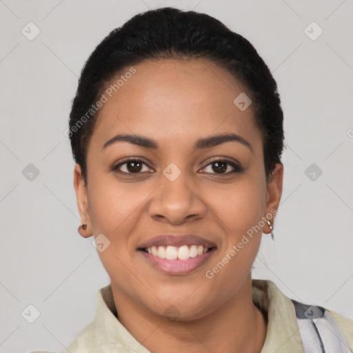 Joyful latino young-adult female with short  black hair and brown eyes