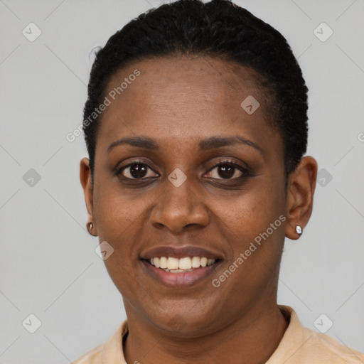 Joyful black young-adult female with short  black hair and brown eyes