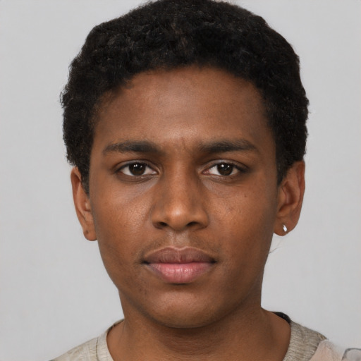 Neutral latino young-adult male with short  brown hair and brown eyes