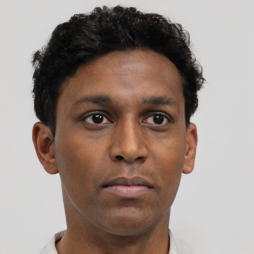 Neutral black young-adult male with short  brown hair and brown eyes