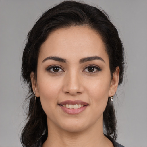 Joyful white young-adult female with medium  brown hair and brown eyes