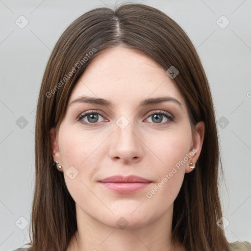 Joyful white young-adult female with long  brown hair and grey eyes