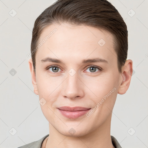 Joyful white young-adult female with short  brown hair and brown eyes