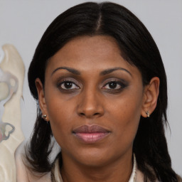 Joyful black young-adult female with medium  brown hair and brown eyes