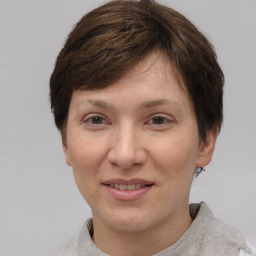 Joyful white adult female with short  brown hair and brown eyes