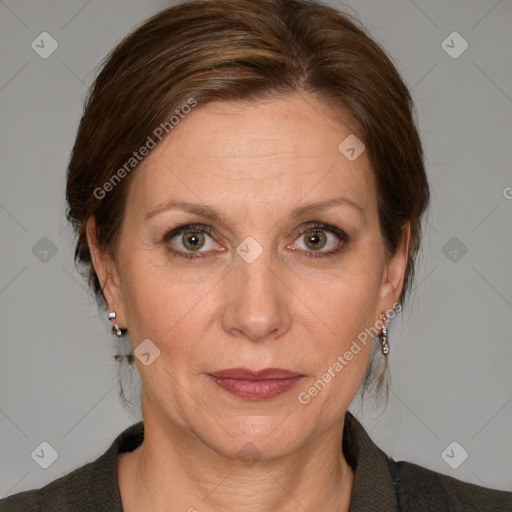 Joyful white adult female with medium  brown hair and blue eyes