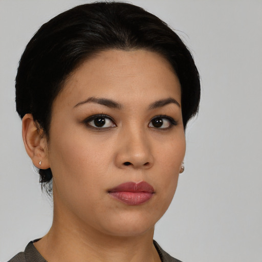 Neutral latino young-adult female with short  black hair and brown eyes