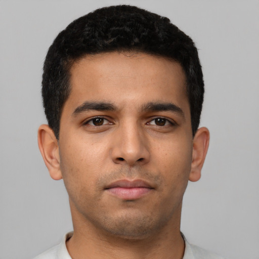 Neutral latino young-adult male with short  black hair and brown eyes