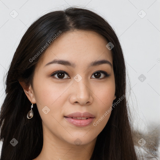 Joyful asian young-adult female with long  brown hair and brown eyes