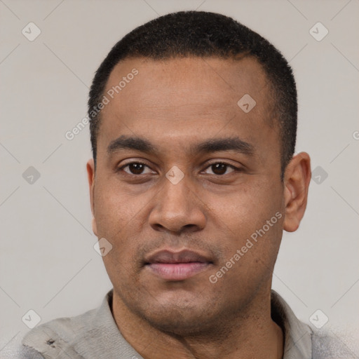Neutral latino young-adult male with short  black hair and brown eyes