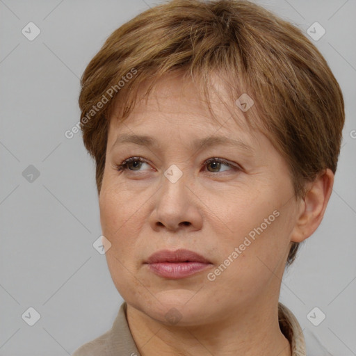 Joyful white adult female with short  brown hair and brown eyes