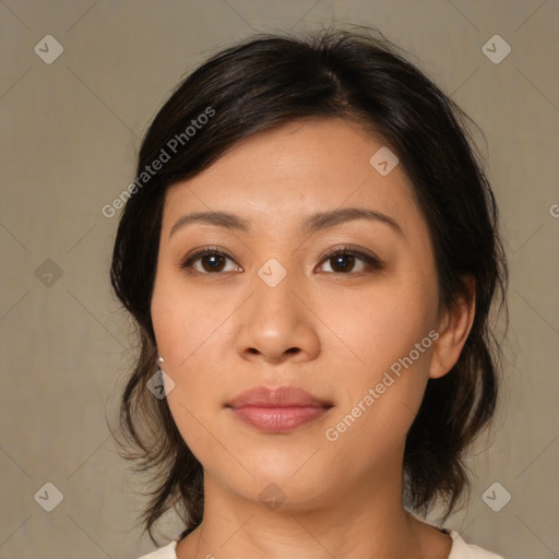 Joyful asian young-adult female with medium  black hair and brown eyes