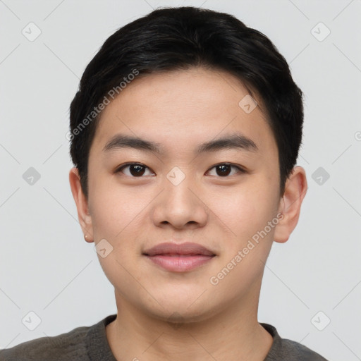 Joyful asian young-adult male with short  black hair and brown eyes