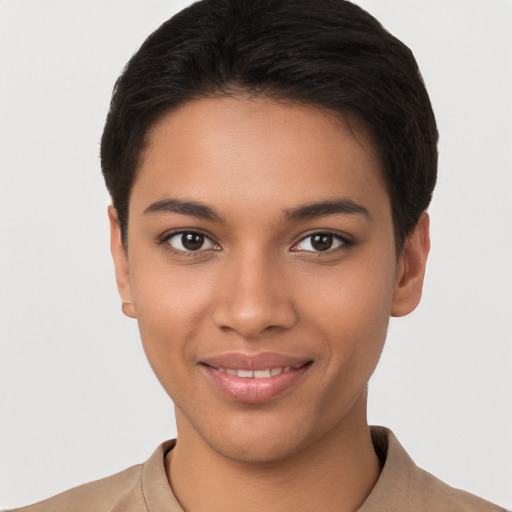 Joyful latino young-adult female with short  brown hair and brown eyes