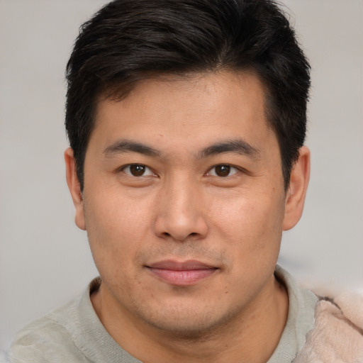 Neutral asian young-adult male with short  brown hair and brown eyes