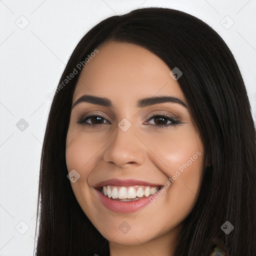 Joyful latino young-adult female with long  black hair and brown eyes