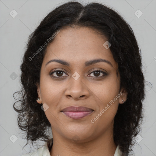 Joyful black young-adult female with long  brown hair and brown eyes