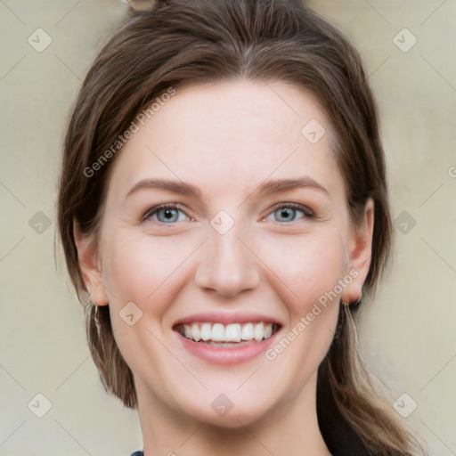 Joyful white young-adult female with long  brown hair and grey eyes