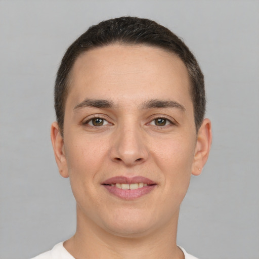 Joyful white young-adult male with short  brown hair and brown eyes