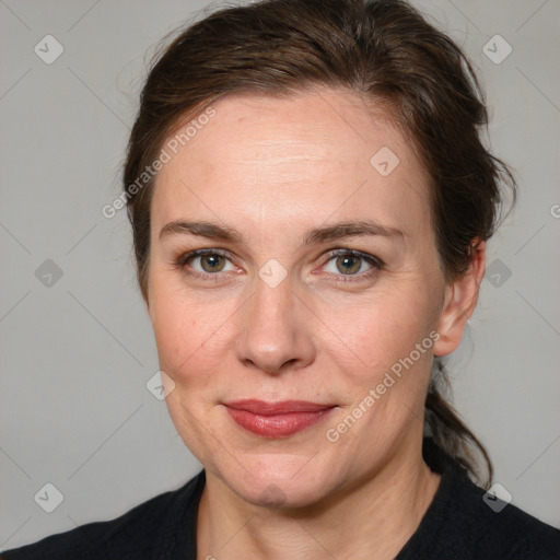 Joyful white adult female with medium  brown hair and grey eyes