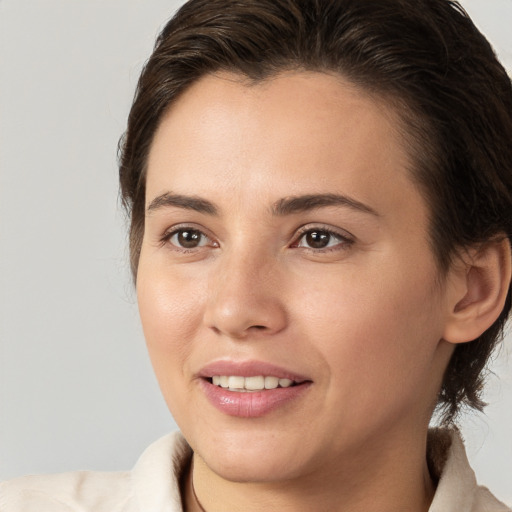 Joyful white young-adult female with medium  brown hair and brown eyes