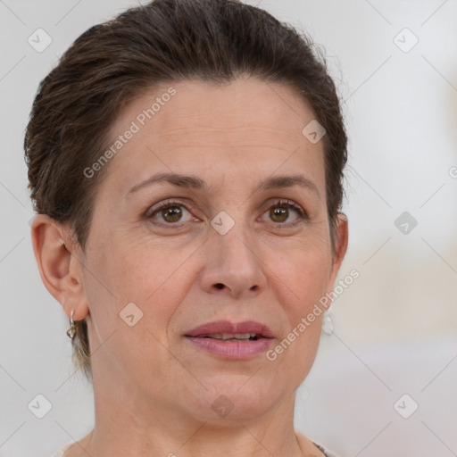 Joyful white adult female with short  brown hair and brown eyes