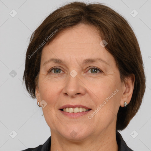 Joyful white adult female with medium  brown hair and grey eyes