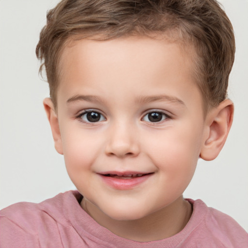 Joyful white child female with short  brown hair and brown eyes