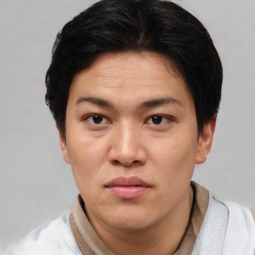 Neutral asian adult female with short  brown hair and brown eyes