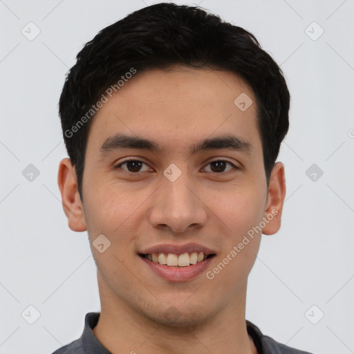 Joyful white young-adult male with short  black hair and brown eyes