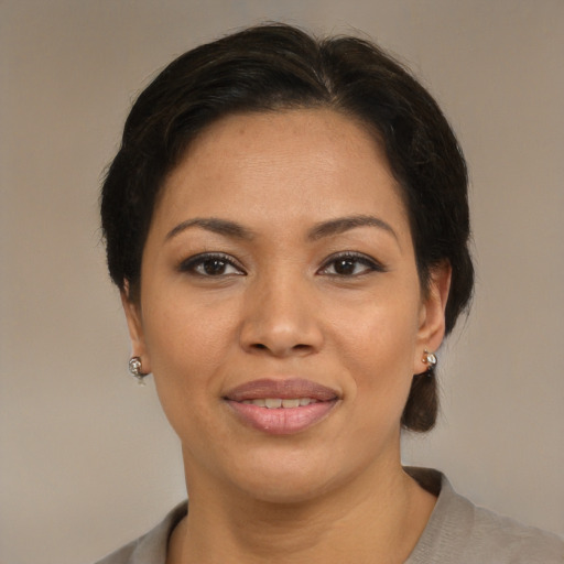 Joyful asian young-adult female with short  brown hair and brown eyes