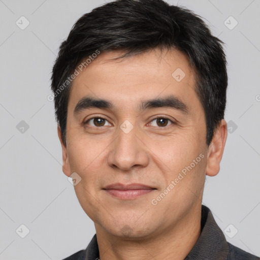 Joyful white young-adult male with short  black hair and brown eyes