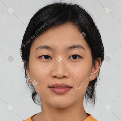 Joyful asian young-adult female with medium  black hair and brown eyes