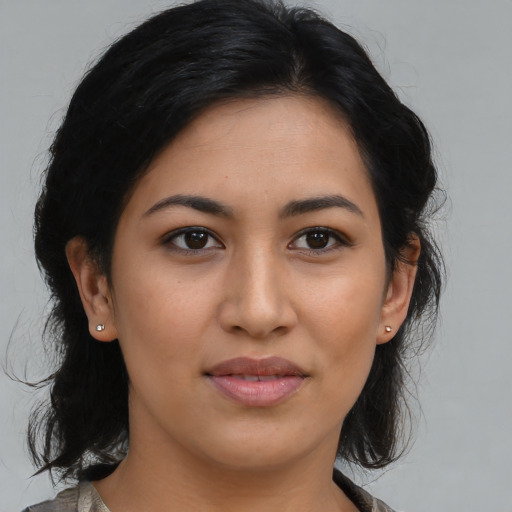 Joyful latino young-adult female with medium  black hair and brown eyes