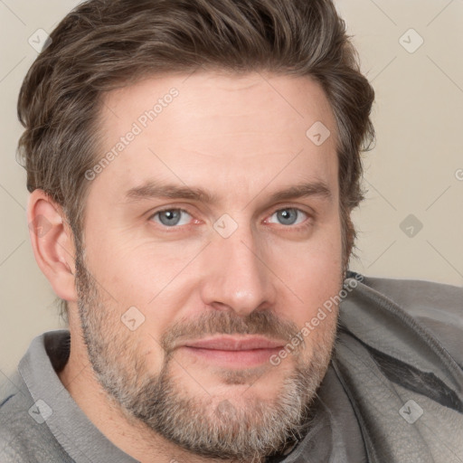 Joyful white adult male with short  brown hair and grey eyes