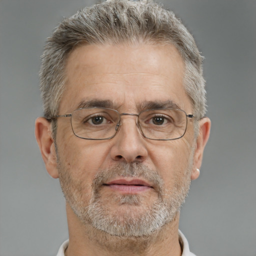 Neutral white middle-aged male with short  gray hair and brown eyes