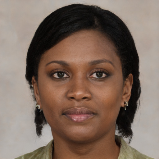Neutral black young-adult female with medium  black hair and brown eyes