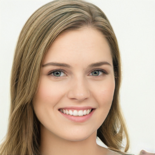 Joyful white young-adult female with long  brown hair and green eyes