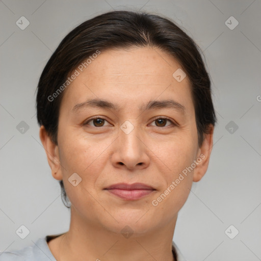 Joyful white adult female with short  brown hair and brown eyes