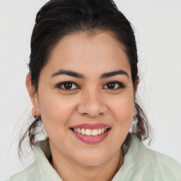 Joyful latino young-adult female with medium  brown hair and brown eyes